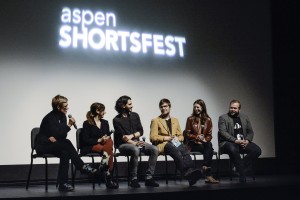 Laura Thielen on stage with filmmakers for a post-screening Q&A
