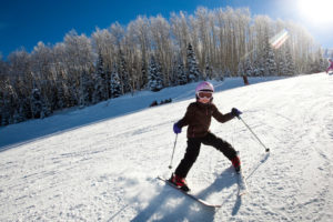 A young kid skiing in Sun Valley, near the Limelight Hotel Ketchum.