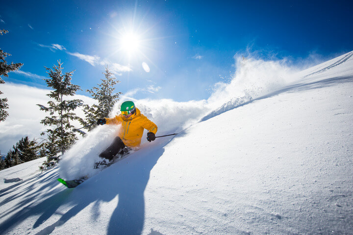 A skier enjoying perfect ski conditions on Bald Mountain in Sun Valley.